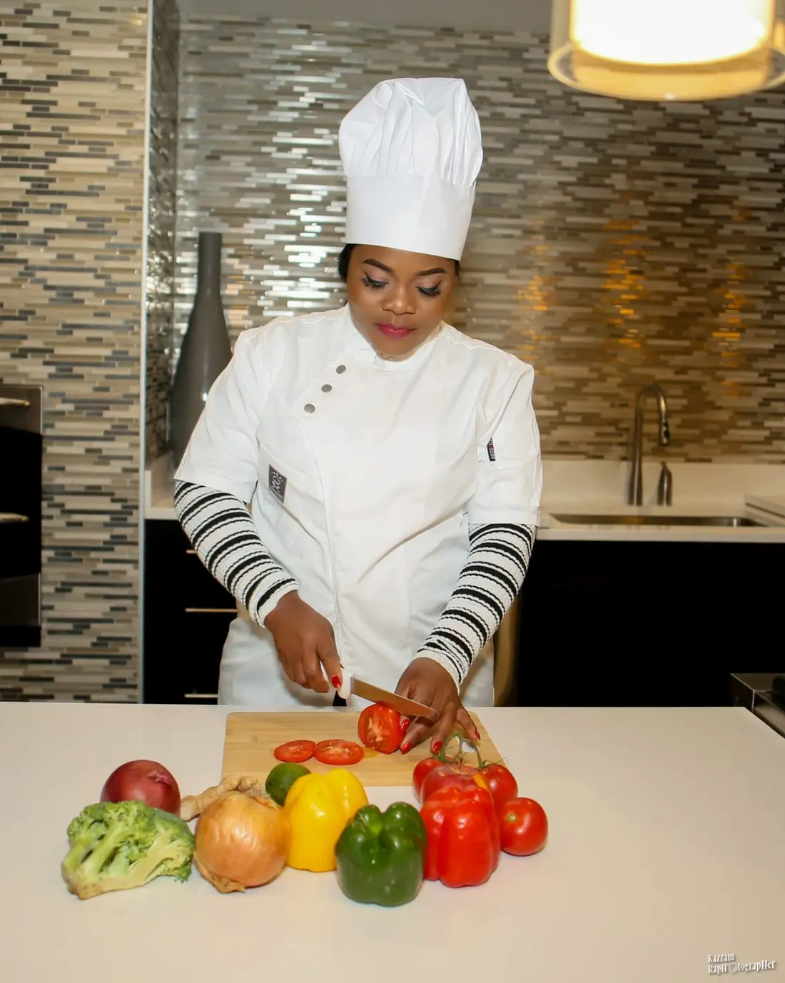 Chef at MayaMoyo Dishes preparing fresh ingredients in the kitchen