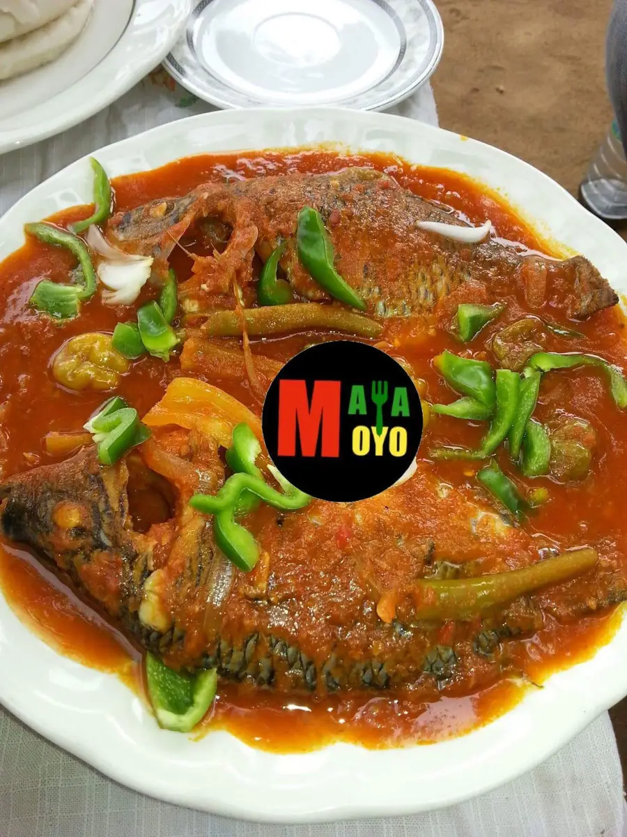 Whole fish in rich tomato stew — West African catering Gaithersburg Maryland